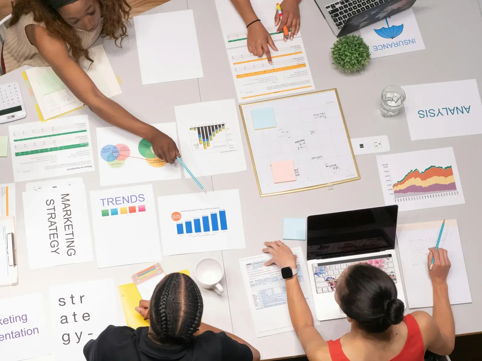 Marketing strategy planning team working together around a table