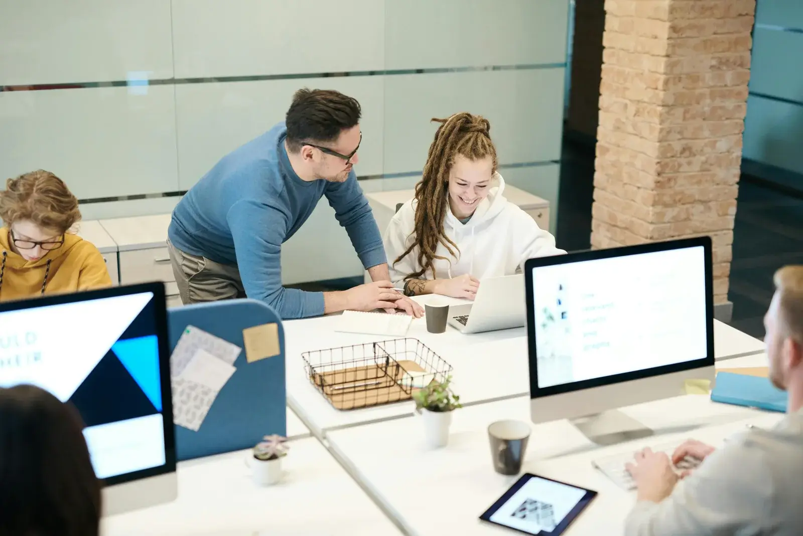 Team collaborating on website design and content strategy during a project meeting