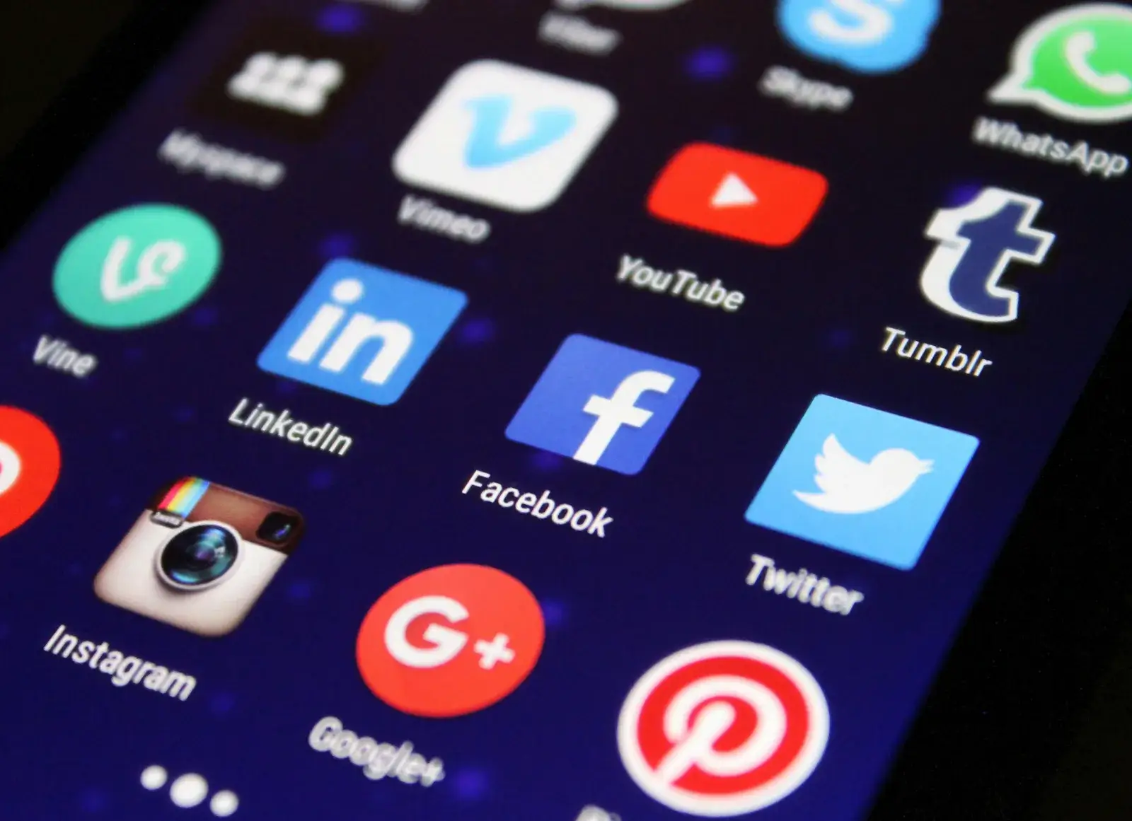 Close-up of smartphone screen showing social media app icons